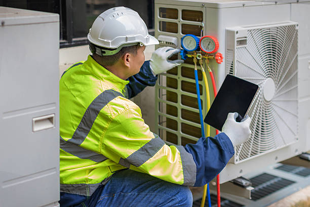Professional Air Duct Cleaning technician working in Brick, NJ
